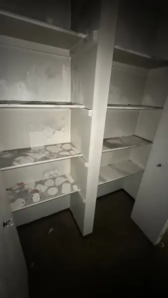 Closet shelving with soot and smoke residue