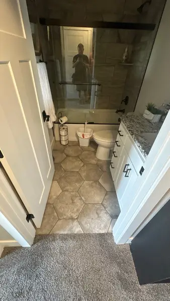 Bathroom with hexagon tile floor
