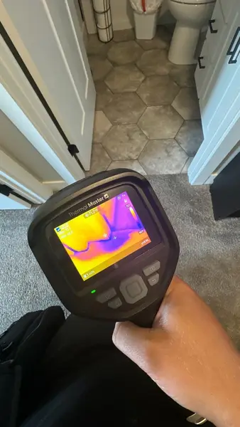 Thermal imaging camera checking a bathroom for hidden moisture