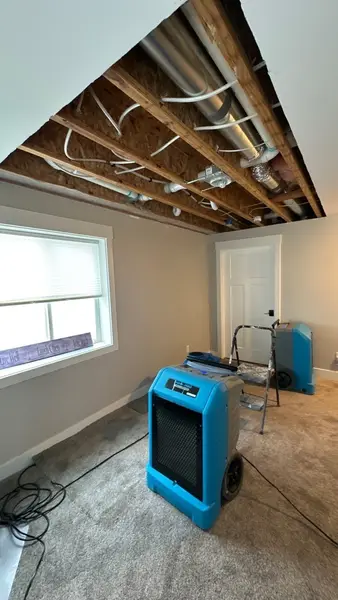 Drying equipment running in a room with the ceiling opened